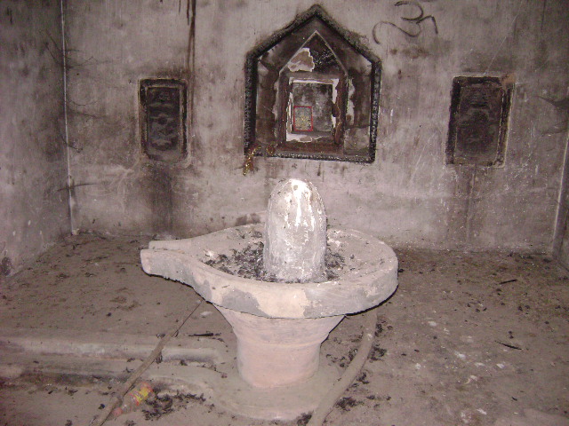 Shiv Lingam inside the burnt temple