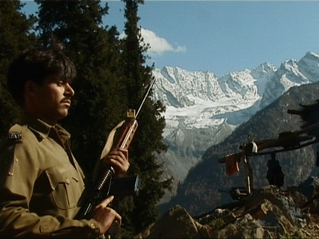 Policemen maintaining vigil en route the newly discovered cave shrine in South Kashmir